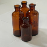 Lot of 4 Vintage Lysol Bottles Multifunctional Durable Amber - No Lid or Stopper