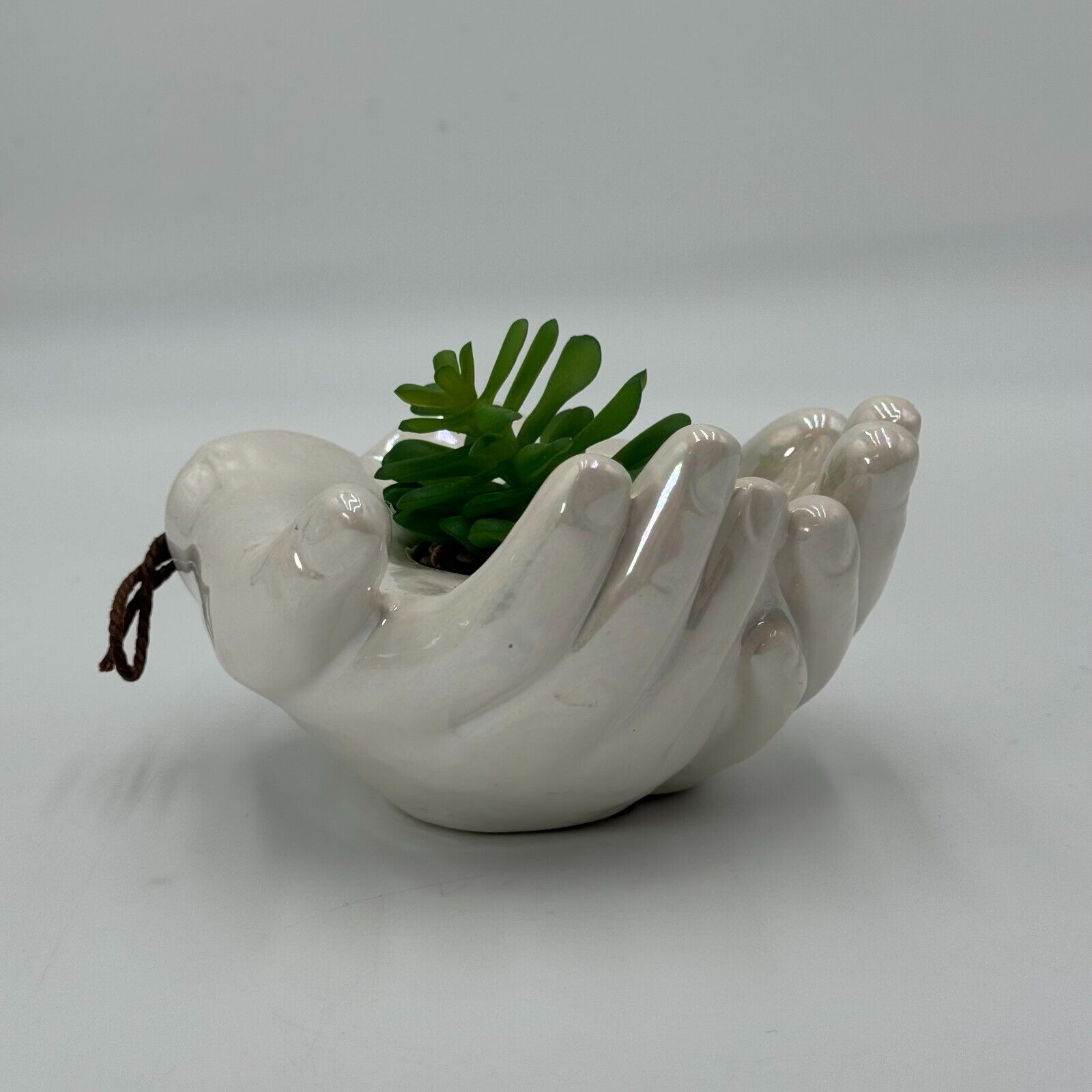 Ceramic Cupped Hands Holding Succulent in Rocks Artificial Fake Plant While Pot