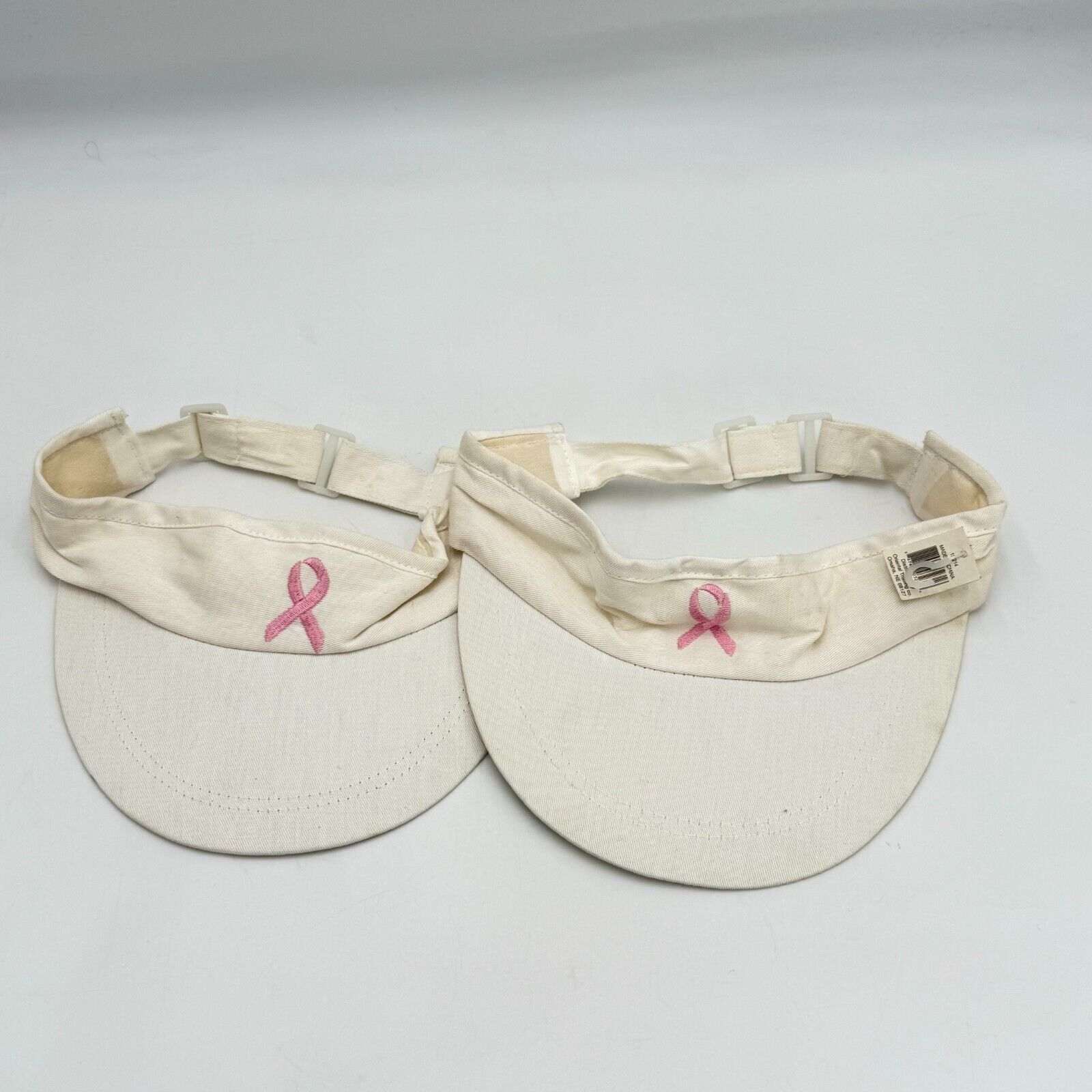 Pair of White Breast Cancer Awareness Visor Hats Pink Ribbon Adjustable NWT