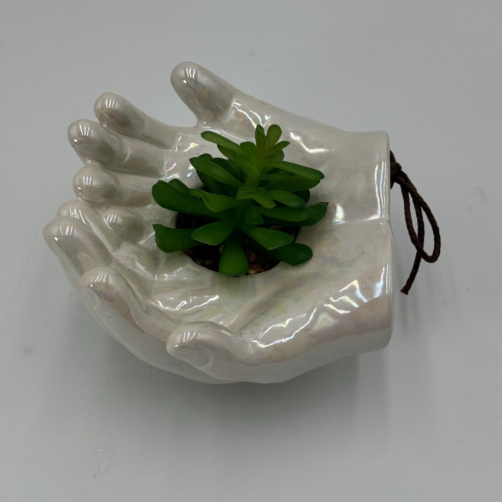 Ceramic Cupped Hands Holding Succulent in Rocks Artificial Fake Plant While Pot