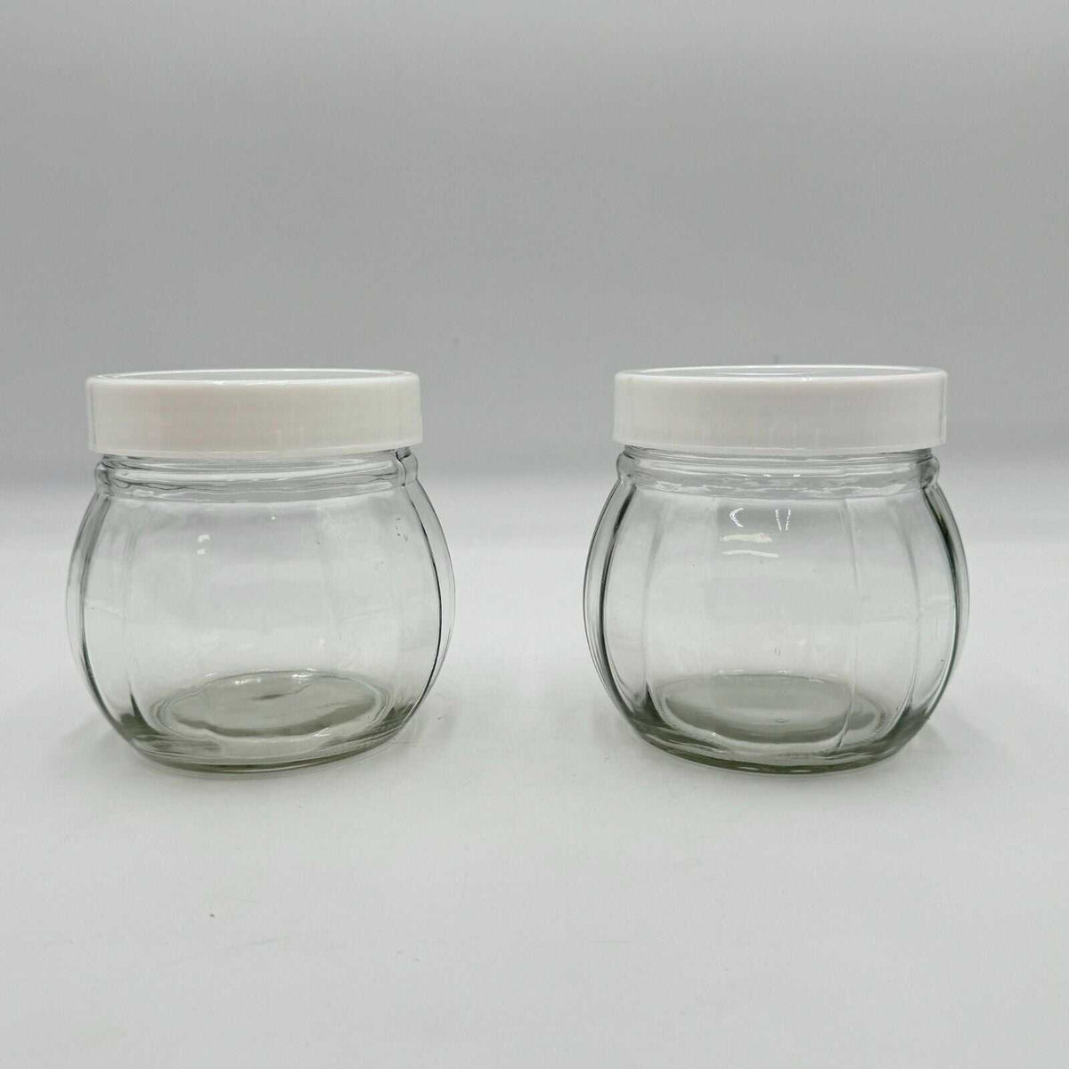 Set of 2 Round Spherical Clear Glass Jars With White Plastic Lids Stackable 4.5"